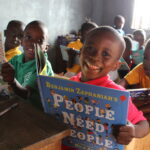 Children reading books from a Book Aid International Discovery Book Box, Sierra Leone