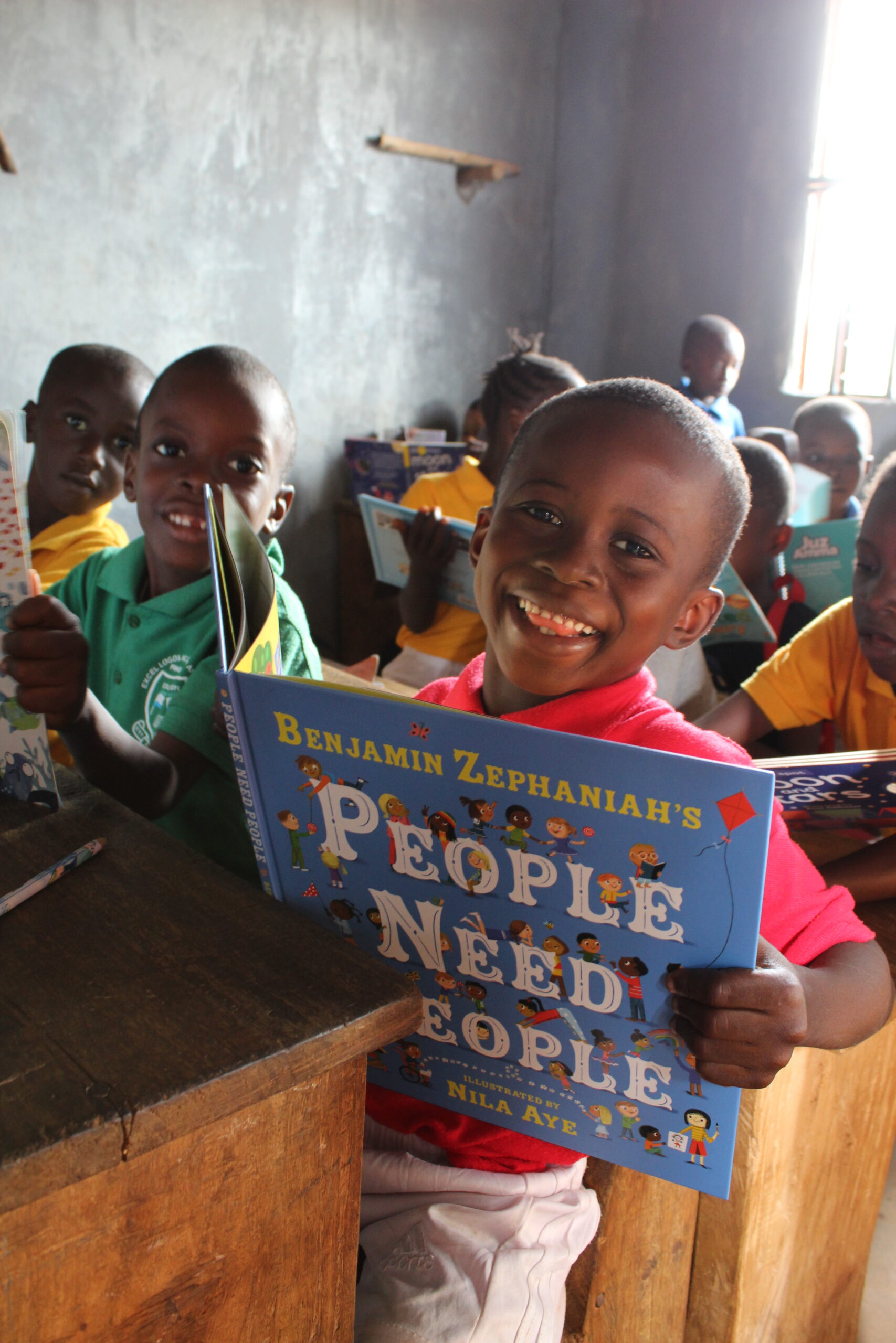 Children reading books from a Book Aid International Discovery Book Box, Sierra Leone