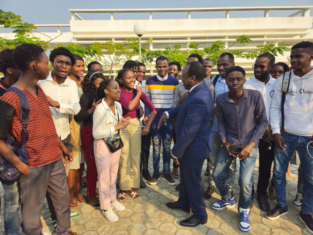 Students gathered in front of a campus facility.